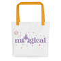 www.parkshirts.store, Tote bag with yellow handles front, graphic image says magical with the "a" taken out and replaced with a silhouette of the magic kingdon castle and Mikey Head and fire works.
