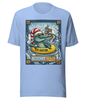 A blue t-shirt with a graphic design depicting a cartoon alligator wearing a red and white striped hat and sunglasses, sitting on a yellow raft labeled "ICE GATOR" and surrounded by snow and ice.